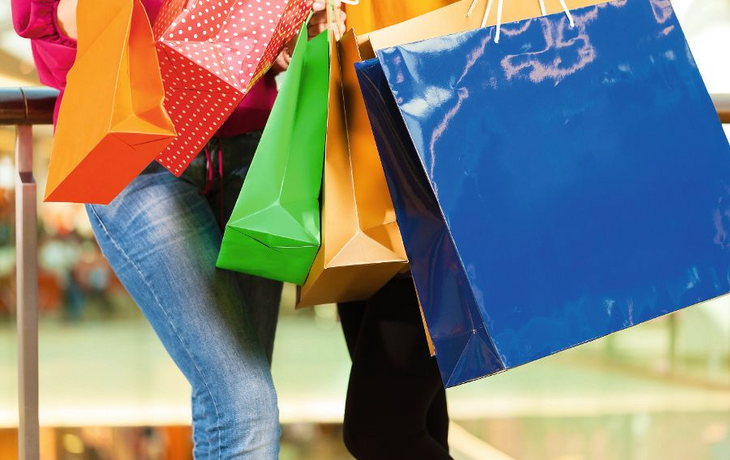 Two women shopping with bags in mall