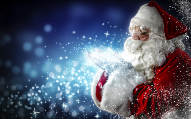 Weihnachtsmann bläst magischen Schnee in der Nachtluft.